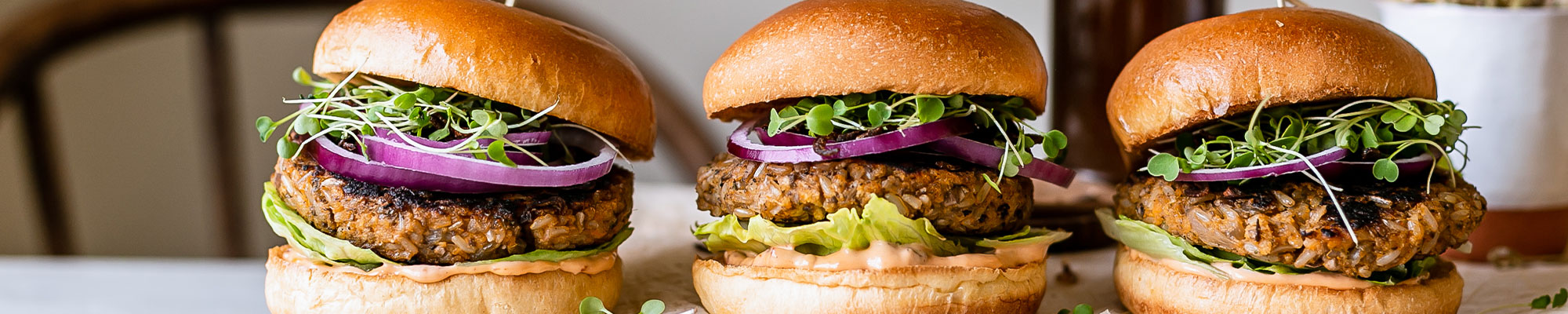 2 rice burgers on a table.