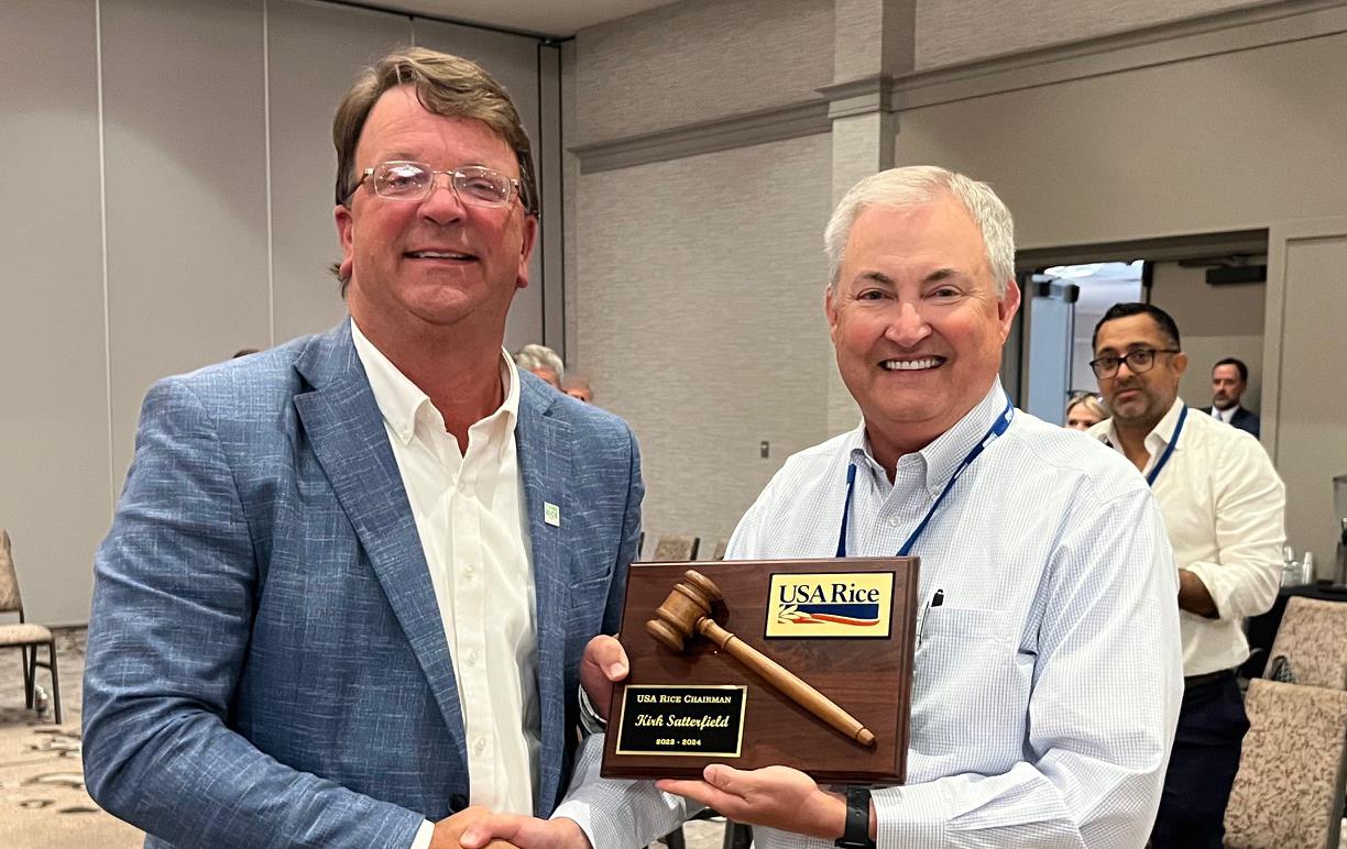 2024 July Business Mtgs, K. Satterfield & K. Glover shake hands and hold plaque w/wooden gavel