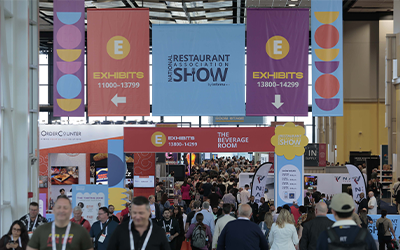 2026 National Restaurant Show Banner hanging above crowd