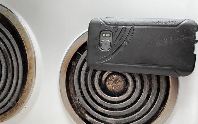 Old cellphone on stove burner