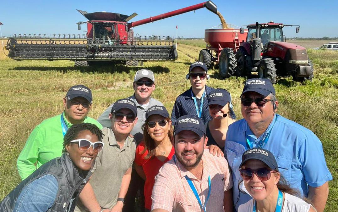 Central Am Trade Mission group shot in front of combine & grain cart at Reiners Farm in LA