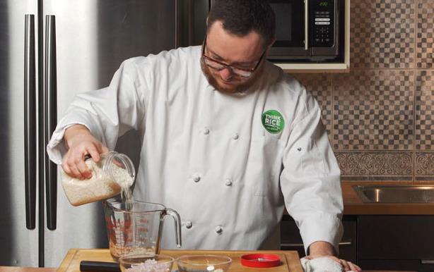 Chef-Hari-Cameron pouring rice into measuring cup