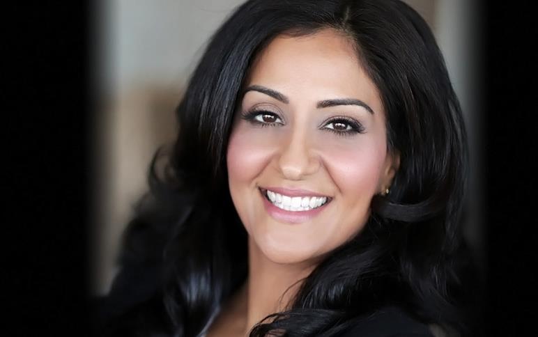 Dr. Shimi Kang headshot, smiling woman with long dark hair