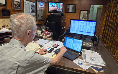 Jerry Morris, at work in his home office, actively trading