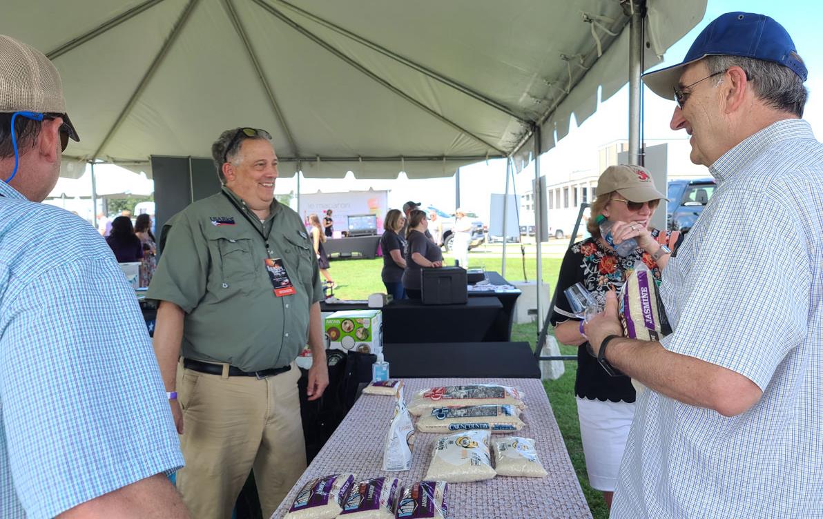 LA-Food-&-Wine-Fest,-in-the-USAR-booth handing out bags of US rice