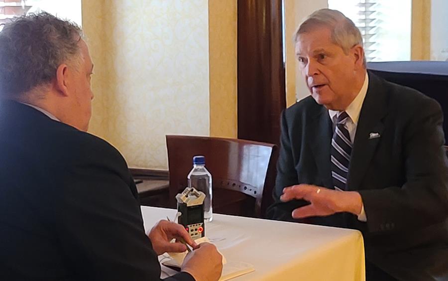 M. Klein interviewing Secretary-Tom-Vilsack, two men seated at table, talking