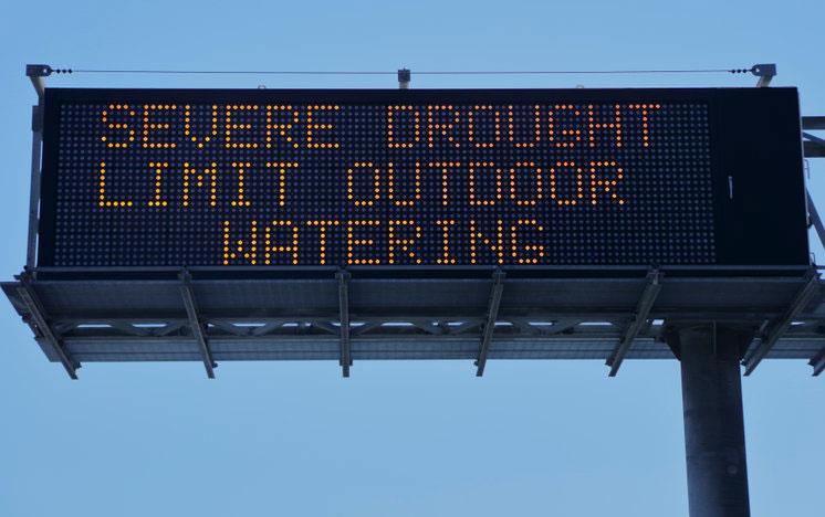 Digital billboard text: Severe Drought Limit Outdoor Watering