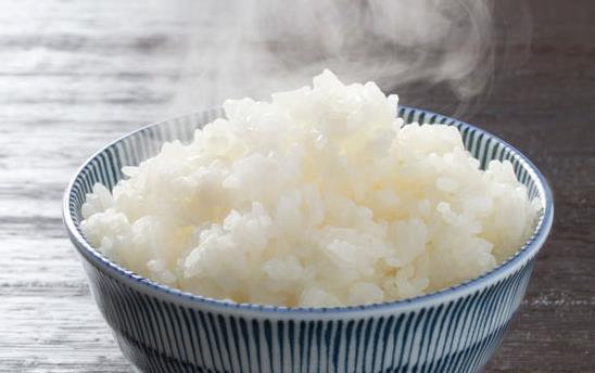 Steaming bowl of white rice