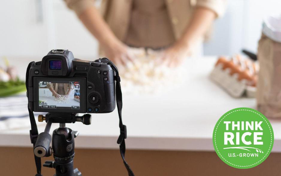 Influencer being filmed while cooking, green circle ThinkRice logo in lower right corner