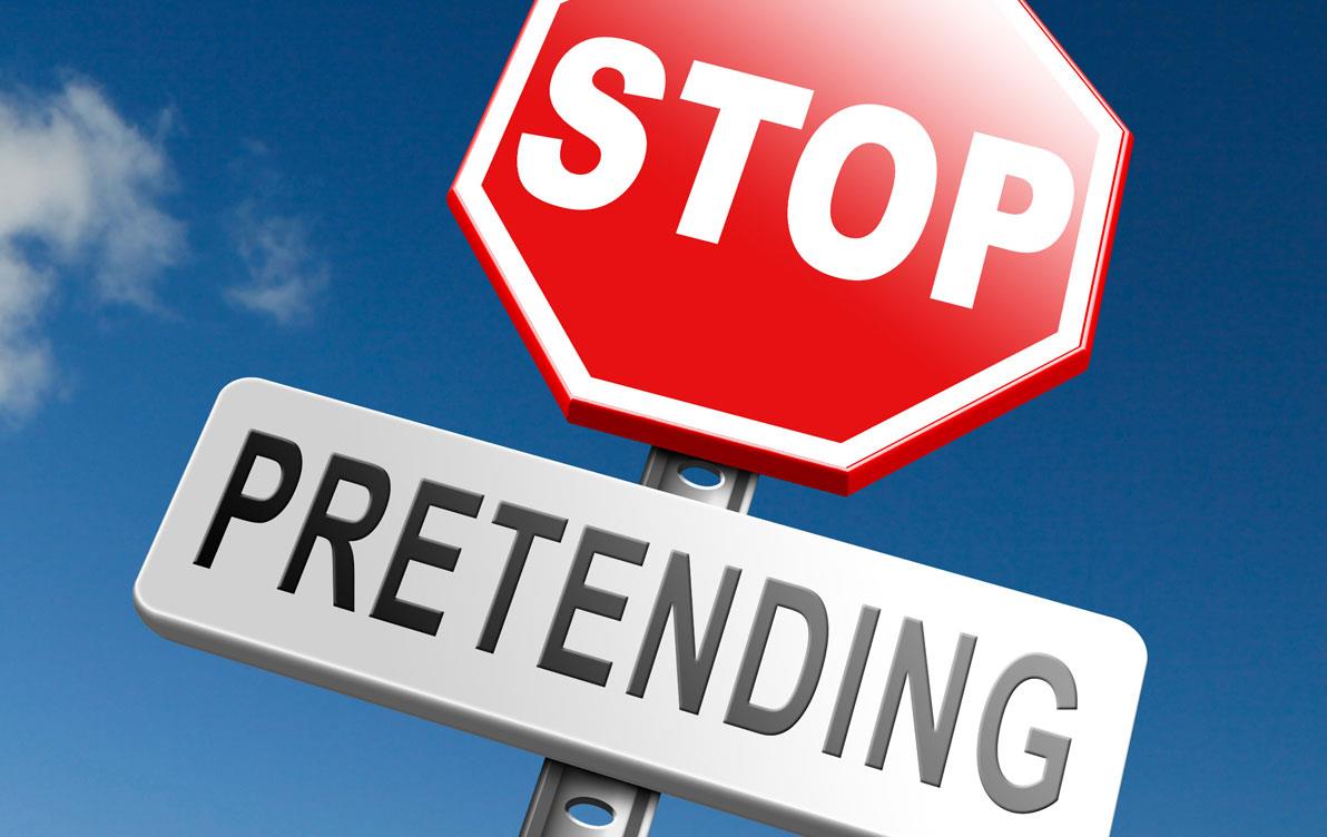 Stop-Pretending-sign against blue sky background