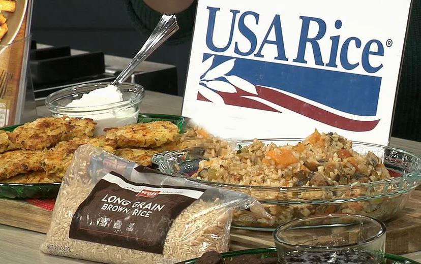 USAR-Logo displayed behind bag of long grain brown rice, and plates of rice fritters & brown rice stuffing