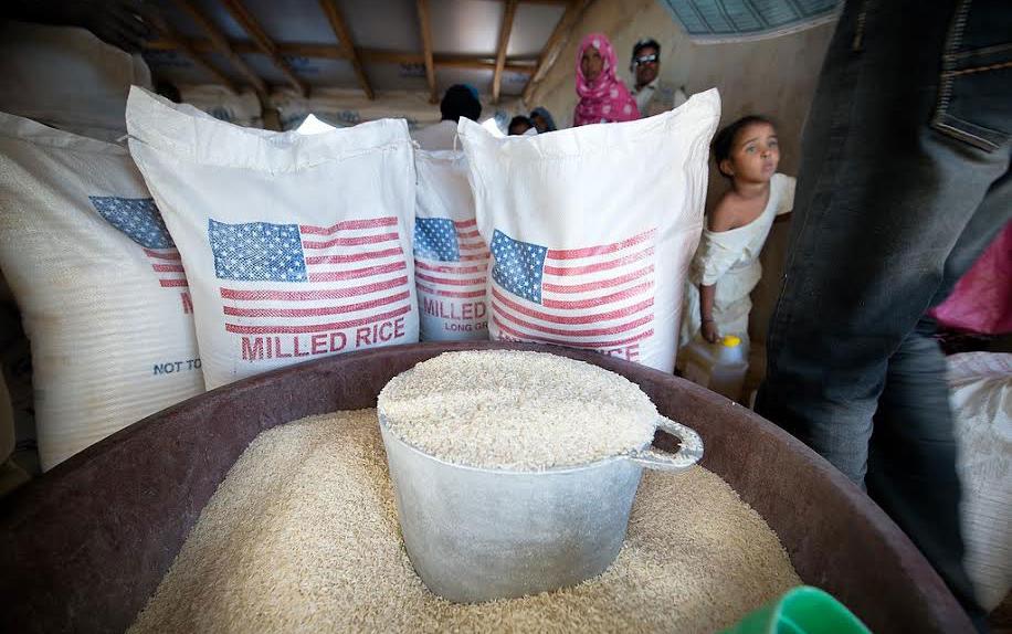US-Milled-Rice in bags w/US flag & in bulk in cast iron kettle