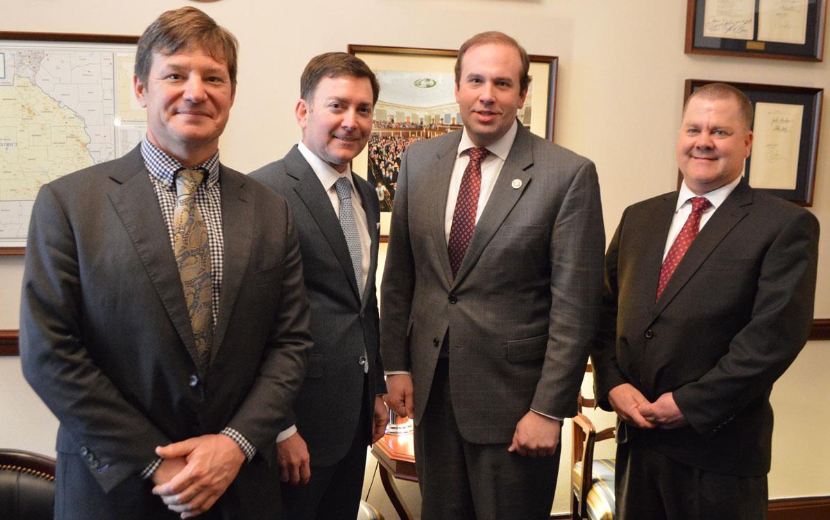 2017-GAC-MO-Delegation-with-Rep.-Jason-Smith, four white men in business suits stand shoulder to shoulder