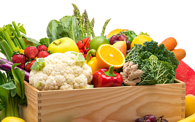 Wooden box overflowing with fruits & vegetables