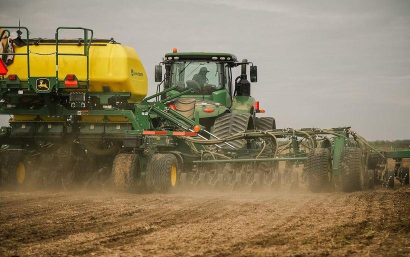 Green combine planting in dirt field, Ryan Sullivan photo
