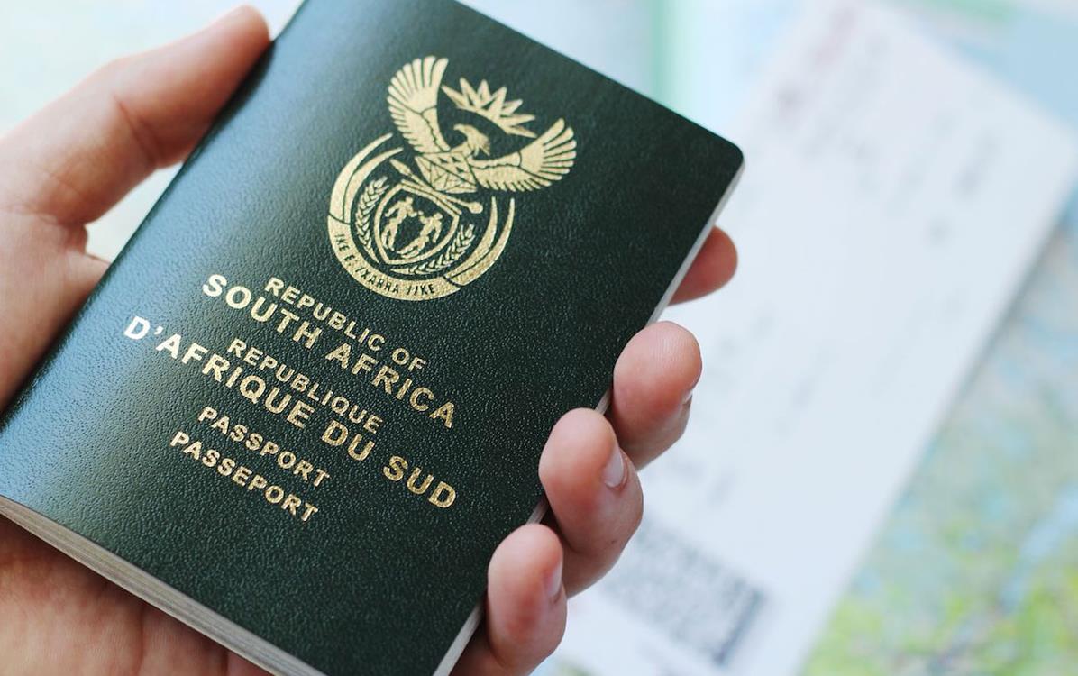 Hand-holding-South-African-passport