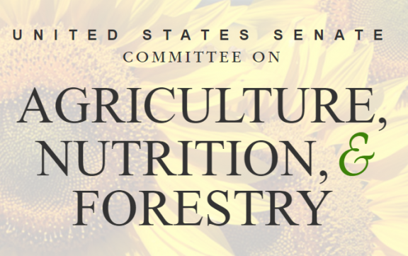 Senate Ag Committee text superimposed over photo of sunflowers