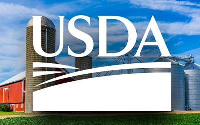 USDA logo superimposed on photo of grain silos and red barn