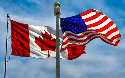 U.S. and Canada Flags Flying