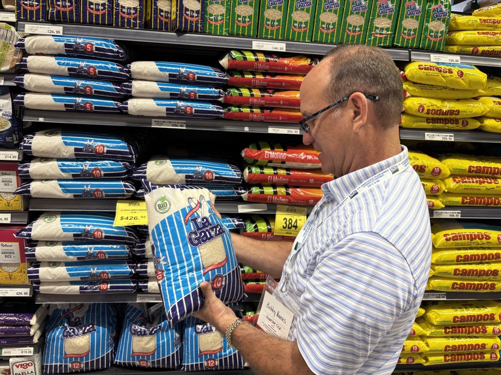 DR Trade Mission, Bobby Hanks shops colorful rice aisle in Santo Domingo grocery store