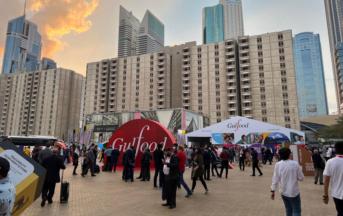 2022-Gulfood-Show, crowded outside plaza surrounded by skyscrapers