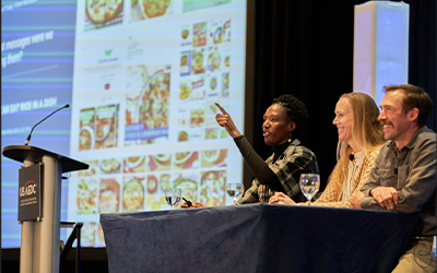 A. Grigsby, S. Moran, & GBHD on stage at USAEDC 2025