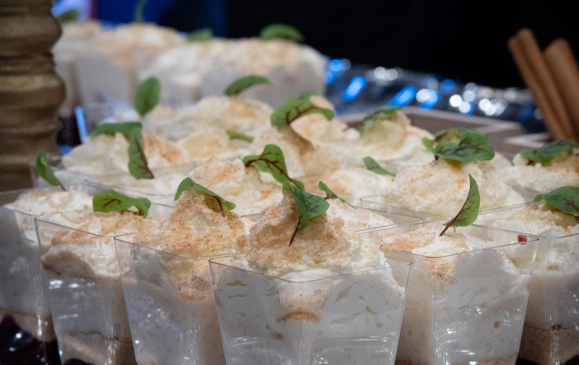 Silver tray filled with cups of arroz-con-leche