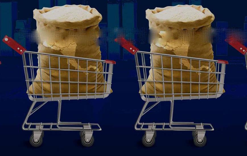 Shopping-carts filled with burlap bags of rice
