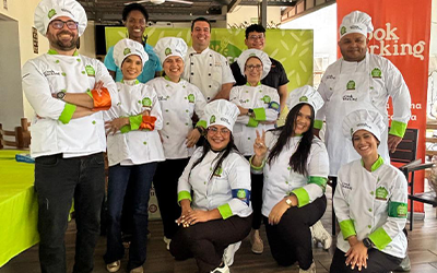 Nicaragua Cooking Competition participants in chef jackets and toques, group shot