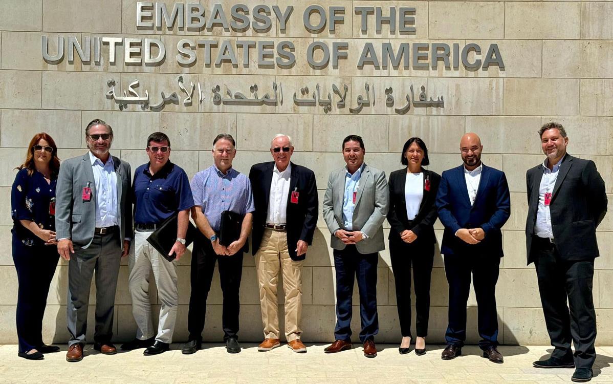 US-Embassy-in-Jordan,-group-shot in front of building