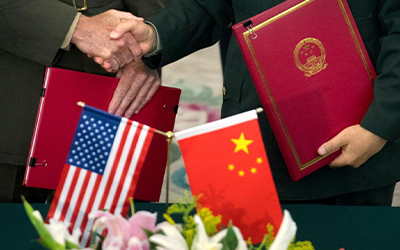 China & US Handshake Deal with flags and flowers