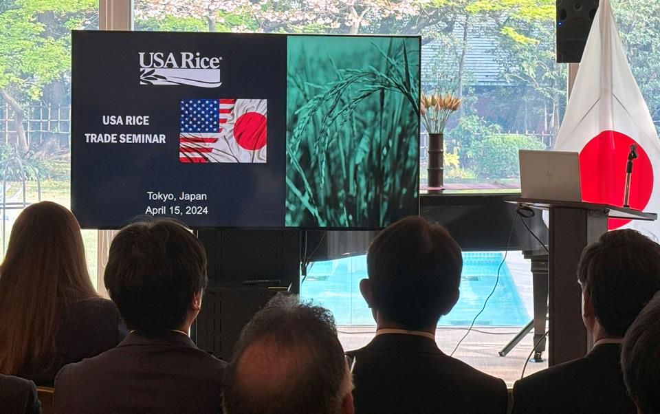 Japan-Trade-Seminar, photo of audience looking at presentation screen & Japanese flag