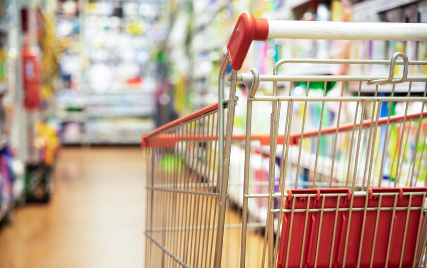 Shopping cart in grocery aisle