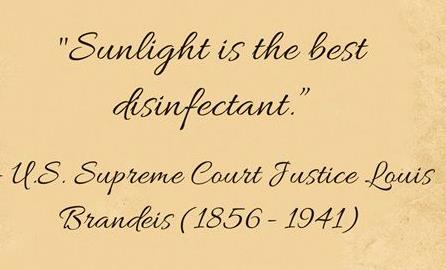 Text "Sunlight is the best disinfectant" on yellowed book page