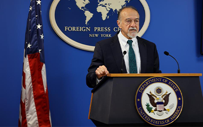 US Ambassador to Haiti, Henry Wooster stands at podium during Foreign Press Center press conference