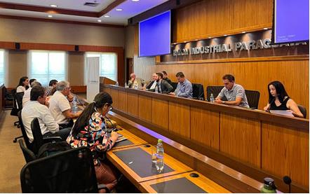 USAR-mtg in-Paraguay, people sitting at desks in conference-room