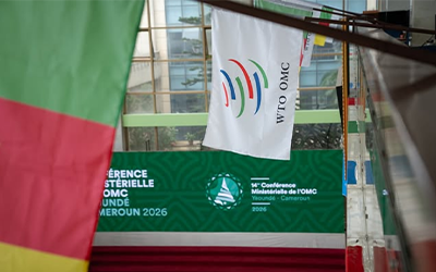 WTO 14th Ministerial banner & welcome flags hang outside building