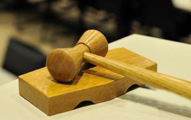 Wooden gavel resting on table