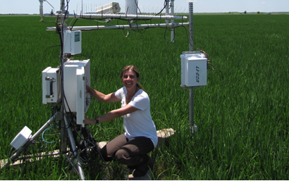 Woman kneeling beside an eddy tower