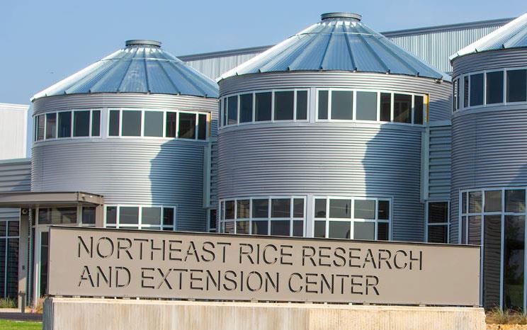 NERREC-sign in front of buildings that look like silos