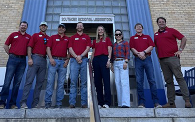 Leadership Session I, group shot in front of USDA Bldg in NOLA, everyone wearing red shirts