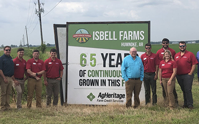 Rice Leadership at Isbell Farm, group shot in front of 65 years continuous rice grown in field