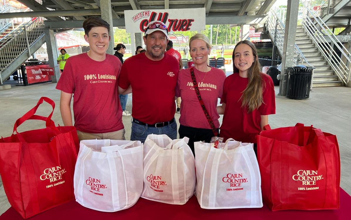 Trahan-Family-at-UL-Baseball-Game-with-Giveaways on table