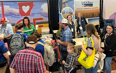 Panorama of crowds around USAR & AR Rice booths at Gin Show