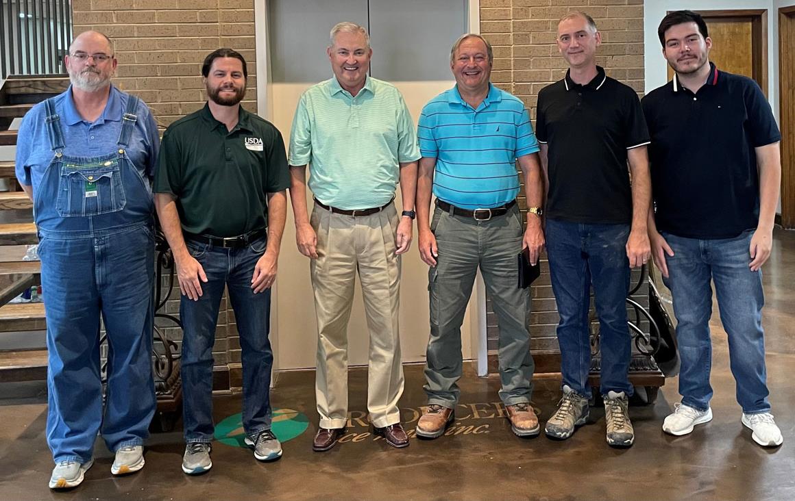 Group shot of USDA-World-Ag-Outlook-Board-at-Producers-Rice