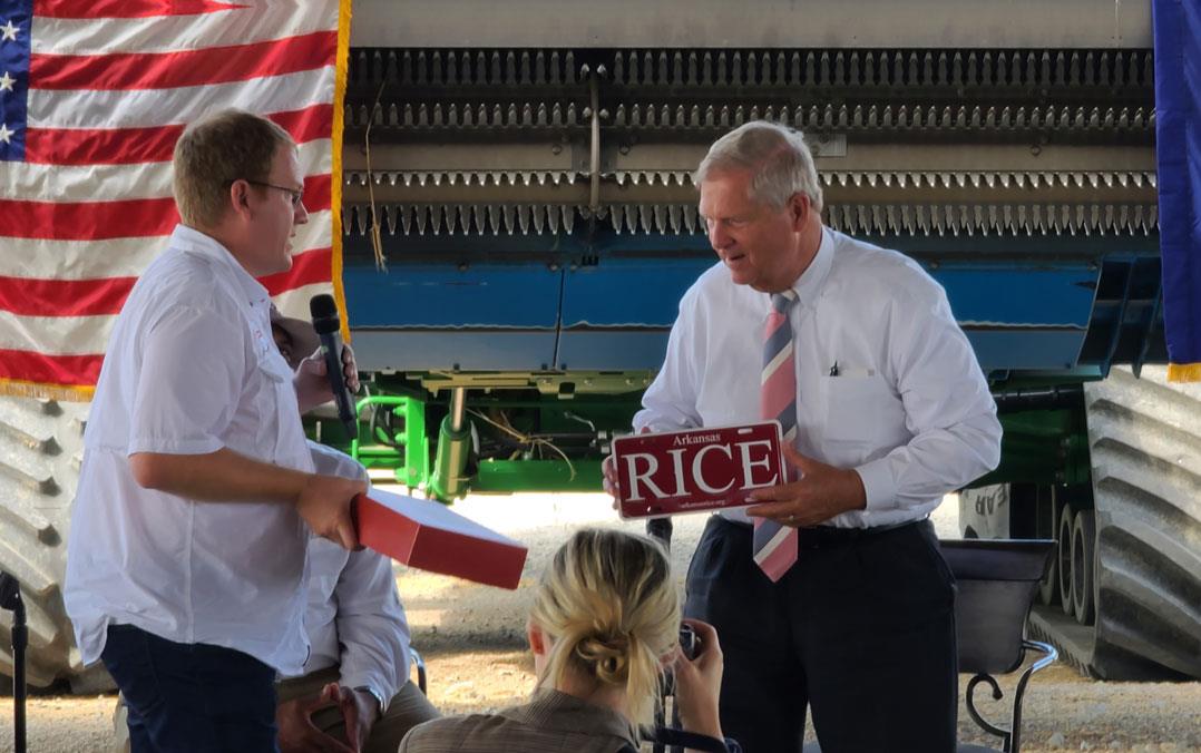 Mark-Isbell-presents Secy-Vilsack with RICE license plate