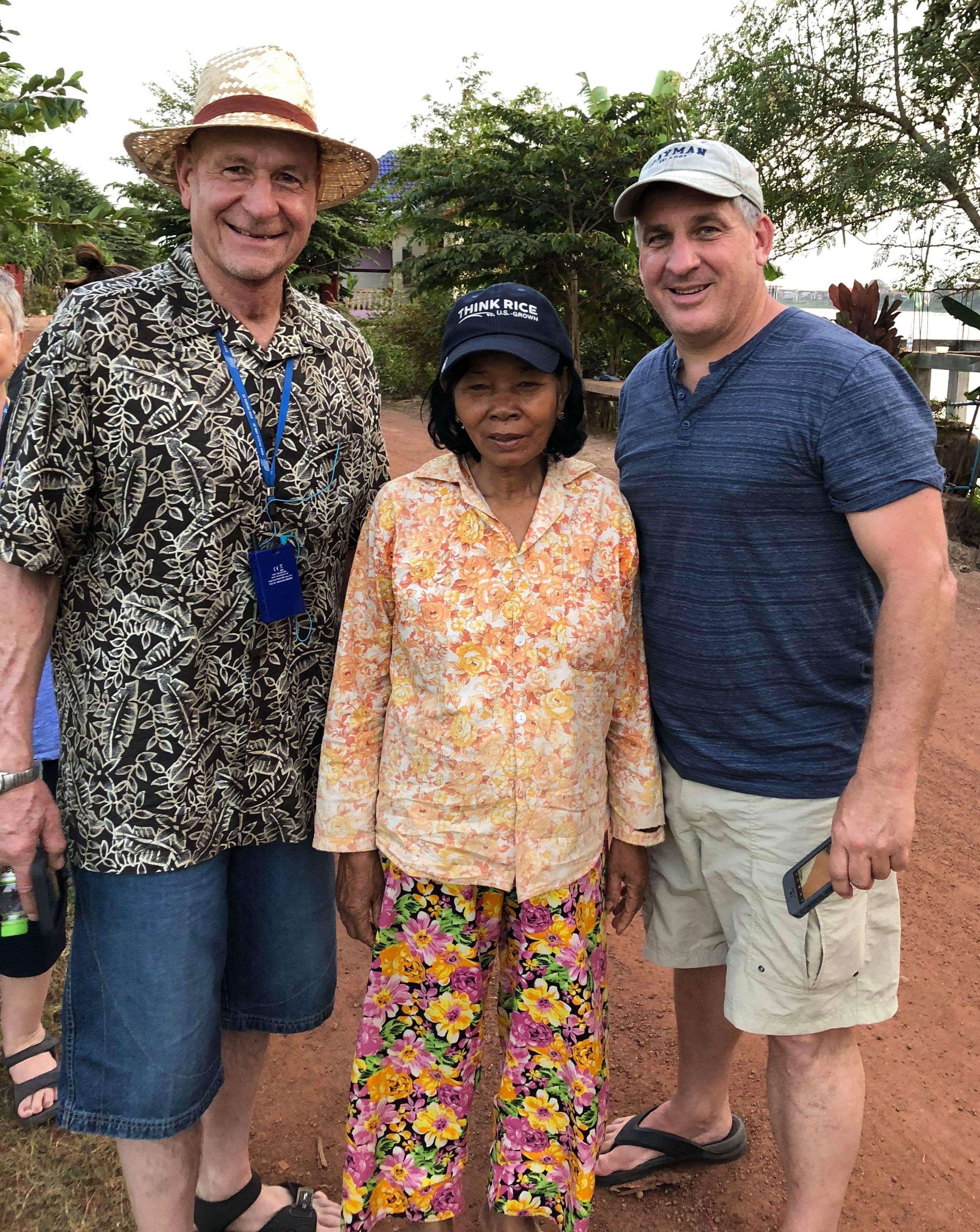 AR ric farmer Robert-Petter-standing with a local-Vietnamese farmer-wearing-ThinkRice-hat-180112