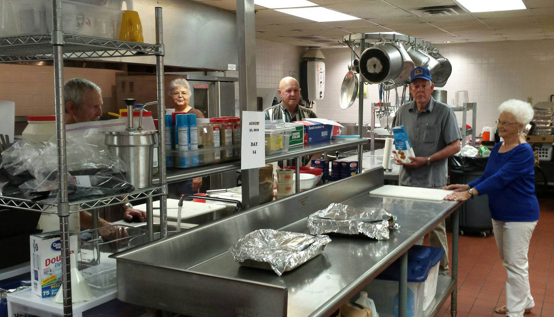 Food prep in the kitchen at St--John-The-Baptist--to Feed-Flood-Victims