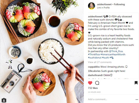 Instagram-post for Heart-Health-Month-Campaign with ingredients for sushi donuts displayed on white table: bowl of rice, colorful veggies & an instamatic camera