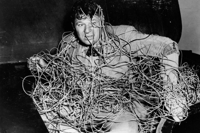 Man tangled up in wires